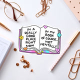 an open book with words on it next to a notebook