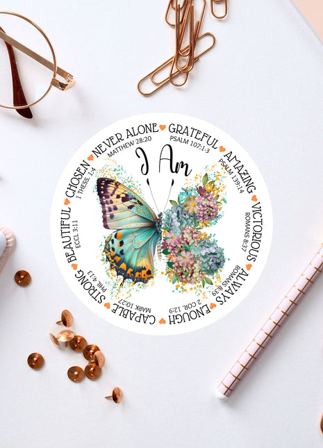 a clock with a butterfly on it next to a notepad