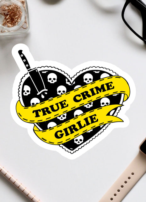 a sticker of a heart with skulls and a banner that says true crime grille