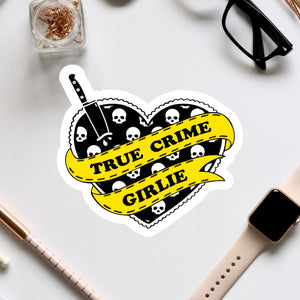 a sticker of a heart with skulls and a banner that says true crime grille