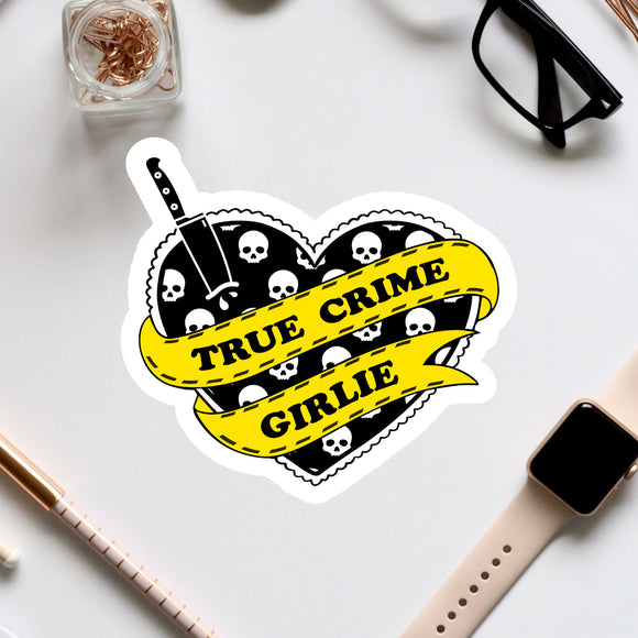 a sticker of a heart with skulls and a banner that says true crime grille