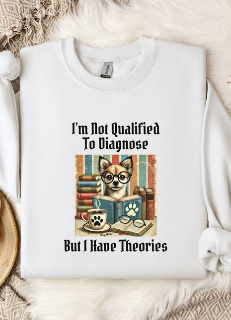 A white t-shirt with a graphic design of a dog wearing glasses and surrounded by books, along with the text "I'm Not Qualified To Diagnose" and "But I Have Theories".