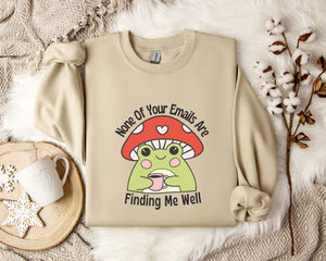a beige sweatshirt with a mushroom graphic and text, along with a mug, a snowflake, and some cotton balls, all placed on a white fur rug.