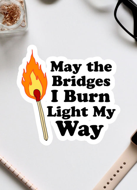 a sticker that says, may the bridges i burn light my way