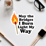 a sticker that says, may the bridges i burn light my way