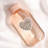 A pink bottle with a heart-shaped sticker that says "Just a girl who needs her snacks"