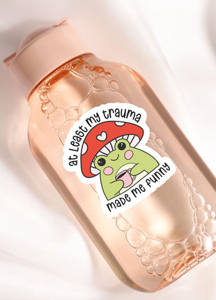 a bottle with a sticker on it sitting on a white surface