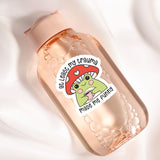 a bottle with a sticker on it sitting on a white surface