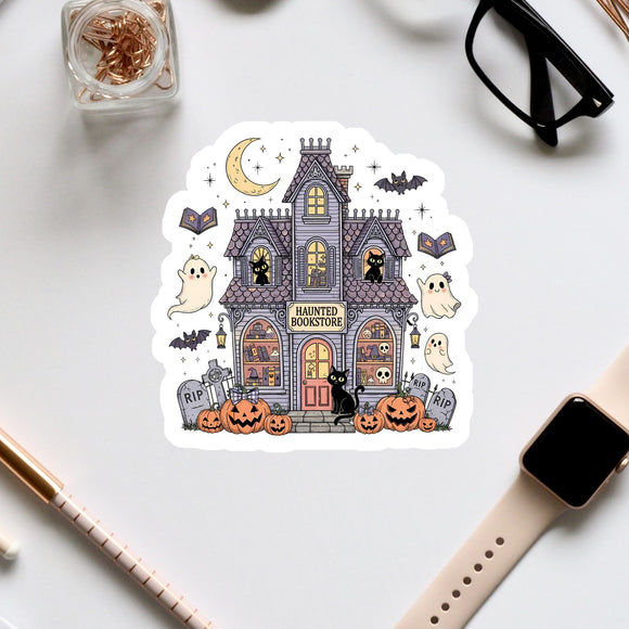 a sticker depicting a spooky house with Halloween-themed decorations, including a crescent moon, bats, pumpkins, and a ghost.