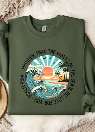 a green sweatshirt with a picture of a sunset on it