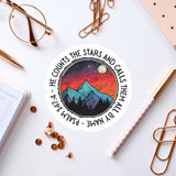 a sticker with a mountain scene on it