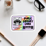 a sticker with a raccoon and the text "Public Library Card" on a white background.