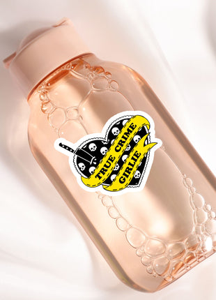 a bottle with a sticker on it sitting on a white surface