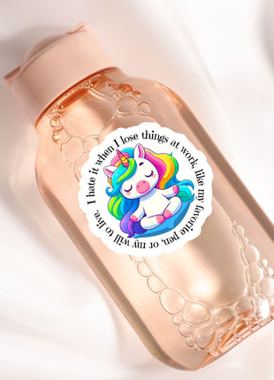 a pink bottle with a unicorn sticker on it