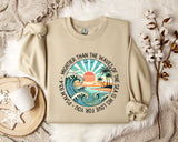 a sweater with a sunset and palm trees on it