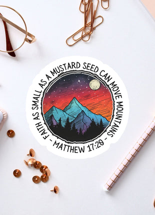 a sticker with a mountain scene on it