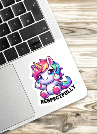 a sticker with a cartoon unicorn and the text "RESPECTFULLY" on a laptop keyboard.