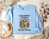A light blue sweatshirt with a printed design of a dog wearing glasses and surrounded by books, along with the text "I'm Not Qualified To Diagnose But I Have Theories".