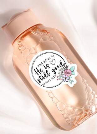 A pink bottle with a label that says "He is not good" and features a floral design.
