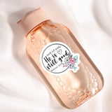 A pink bottle with a label that says "He is not good" and features a floral design.