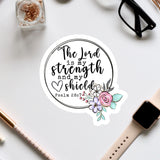 a sticker with a quote from the Bible verse Psalm 28:1, surrounded by a floral design.
