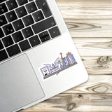 a sticker with a cartoon illustration of a bookshelf on a laptop keyboard.