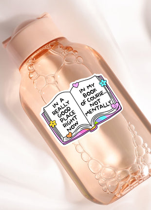 a bottle with a sticker on it sitting on a white surface