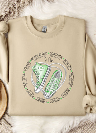 a sweater with a pair of sneakers on it