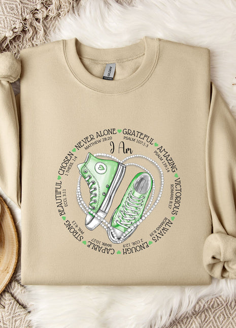 a sweater with a pair of sneakers on it