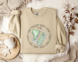 a sweater with a pair of sneakers on it
