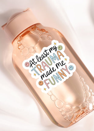 a bottle with a sticker on it sitting on a white surface