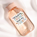 a bottle with a sticker on it sitting on a white surface