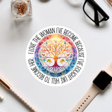 a colorful, intricate tree design with a quote around it, surrounded by various office supplies such as a pair of glasses, a watch, and a pen.