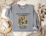 a gray sweatshirt with a humorous text and an illustration of a cat wearing glasses and surrounded by books.