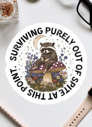 a sticker with a raccoon sitting on a mushroom