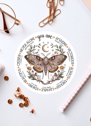 a sticker with a picture of a moth on it