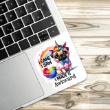 A sticker with a pug dog wearing a unicorn hat and the text "I CAME I SAW I MADE IT AWKWARD" is placed on a laptop keyboard.