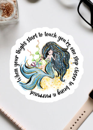 a sticker with a picture of a mermaid on it