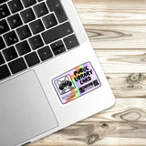 A sticker with a raccoon and the text "Public Library Card" is placed on the side of a laptop keyboard.