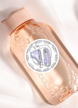 a close up of a bottle on a white surface