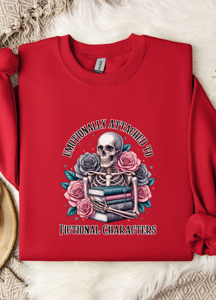 A red sweater with a skull and floral design, along with a mug and some white flowers, is displayed on a white fur rug.
