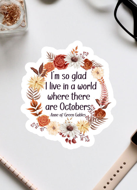 a sticker with a quote from the book "Anne of Green Gables" surrounded by a wreath of autumn flowers and leaves.
