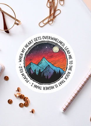 a sticker with a picture of a mountain and stars on it