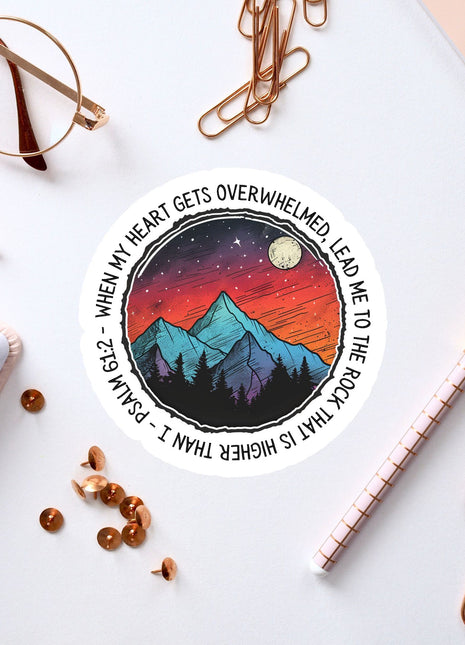 a sticker with a picture of a mountain and stars on it