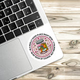 A sticker with a cartoon image of a jar of pickles and the text "In a really good place right now, not mentally ill" is placed on a laptop keyboard.