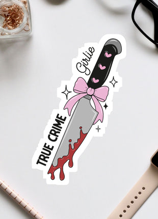a sticker of a knife with a pink bow on it