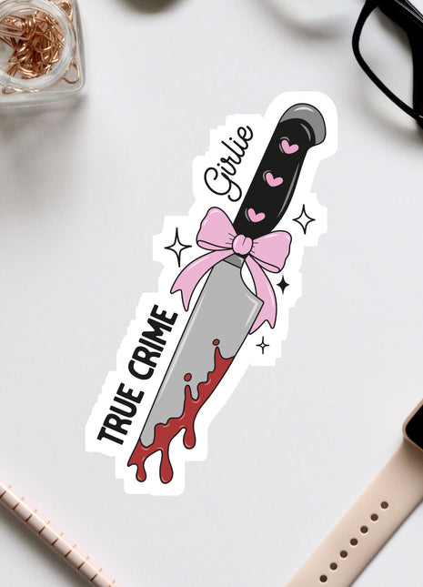 a sticker of a knife with a pink bow on it