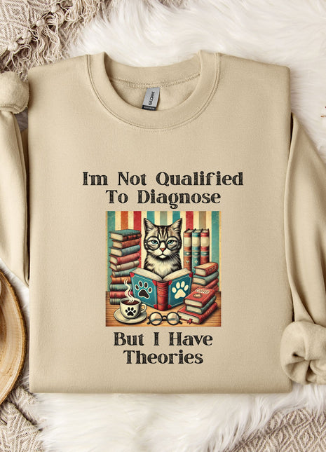 a beige sweatshirt with a humorous text and an illustration of a cat surrounded by books, placed on a bed with a white blanket and a mug.