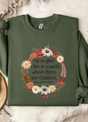 A green sweatshirt with a floral design and text printed on it, placed on a white fur rug.