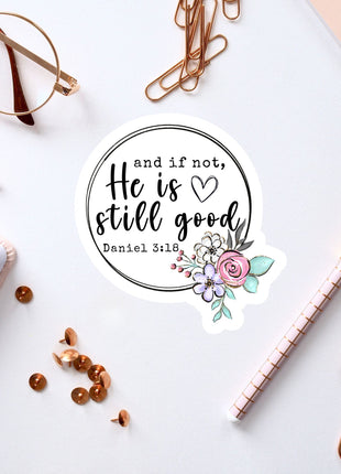 a white background with various office supplies and a sticker with a quote.